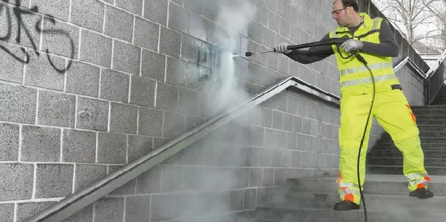 removing graffiti from the wall